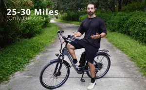 Rider demonstrating the Funhang step-through electric bike with a 25–30 mile range on throttle-only mode.