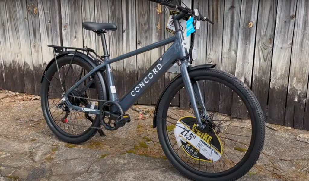 Concord Commutr step-over city e-bike with integrated battery, rear rack and full fenders.